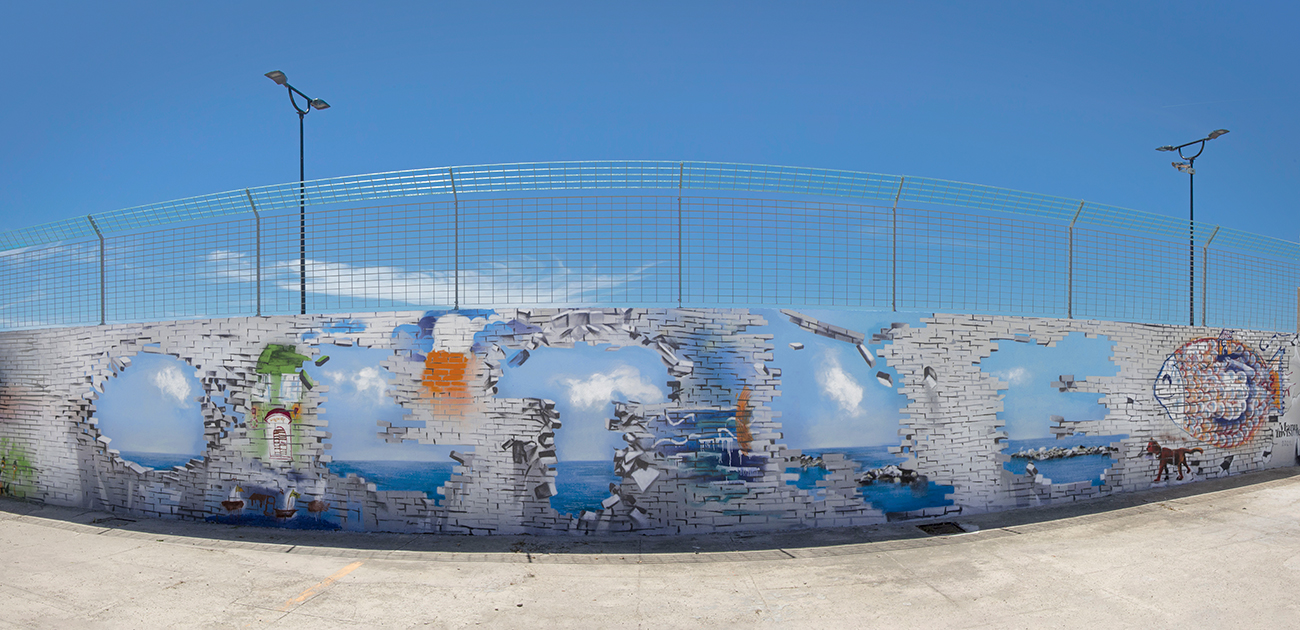 ''OLTRE'' Pittura silossanica e spray su muro 16 x 2 m Cagliari 2021